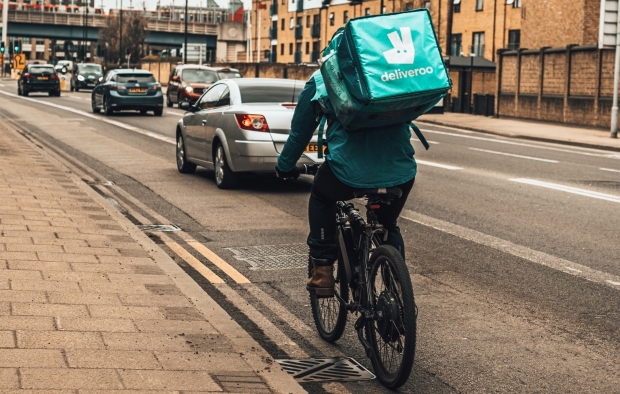 A cyclist riding on a public road