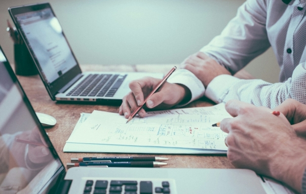 Two people working on a document